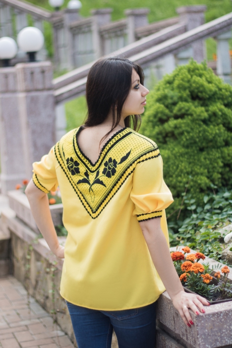 Yellow women's blouse in boho style, stylized as an embroidered shirt with short sleeves
