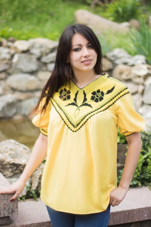 Yellow women's blouse in boho style, stylized as an embroidered shirt with short sleeves